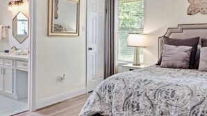 A bedroom with a bed, a mirror, a dresser, and a window. - Super Cozy Entire House. Close to Everything (Katy)