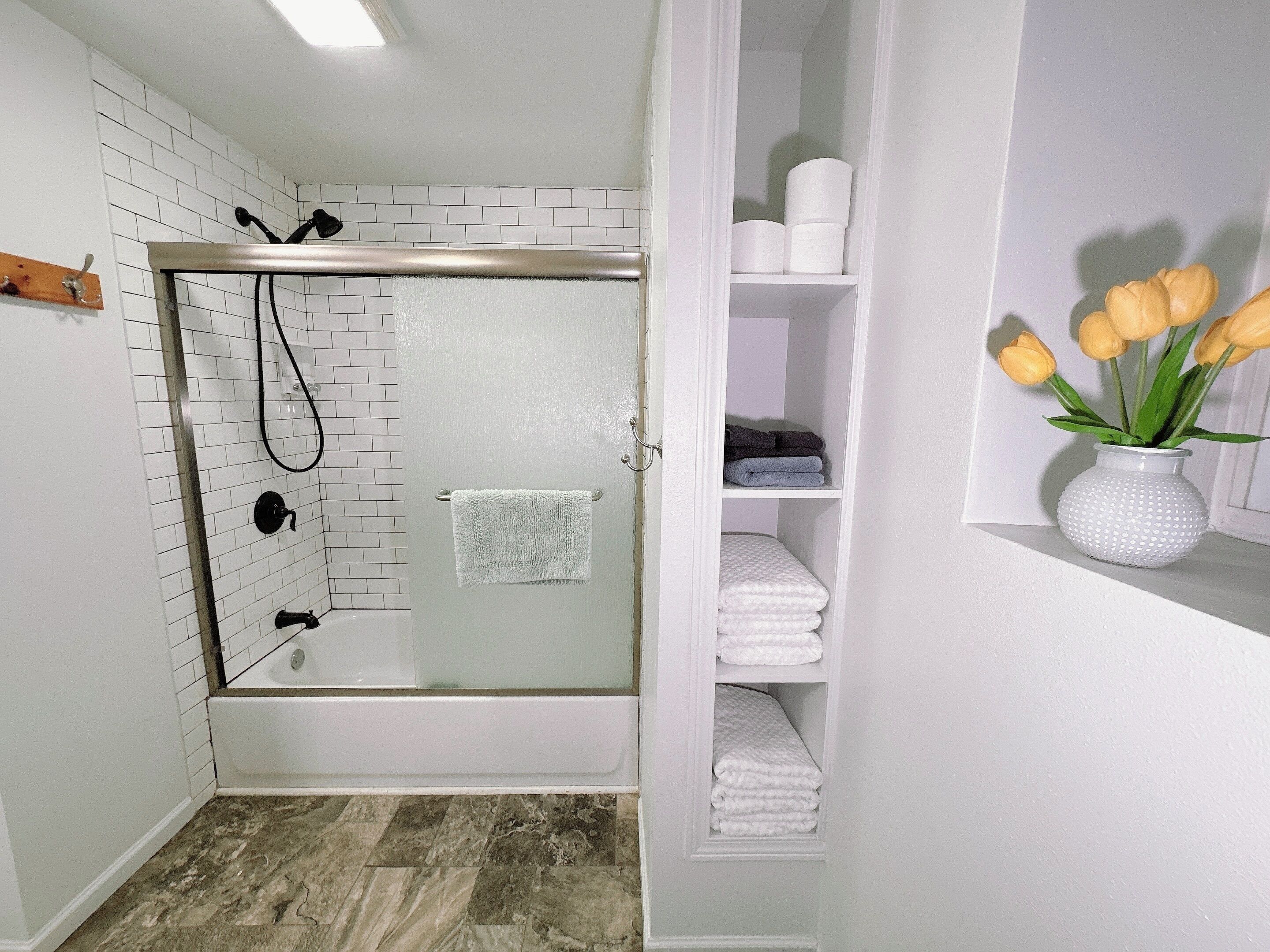 Combined shower/bathtub, hair dryer, towels, soap