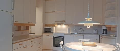 Comfort Apartment | Private kitchen | Full-size fridge, microwave, oven, stovetop