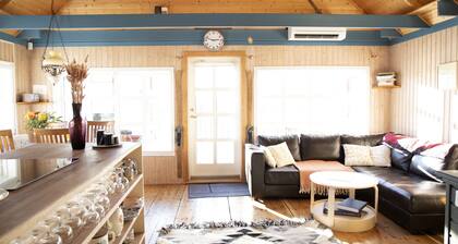 Northern Lights Cabin. Quiet location next to the river. Sublime Mountain views