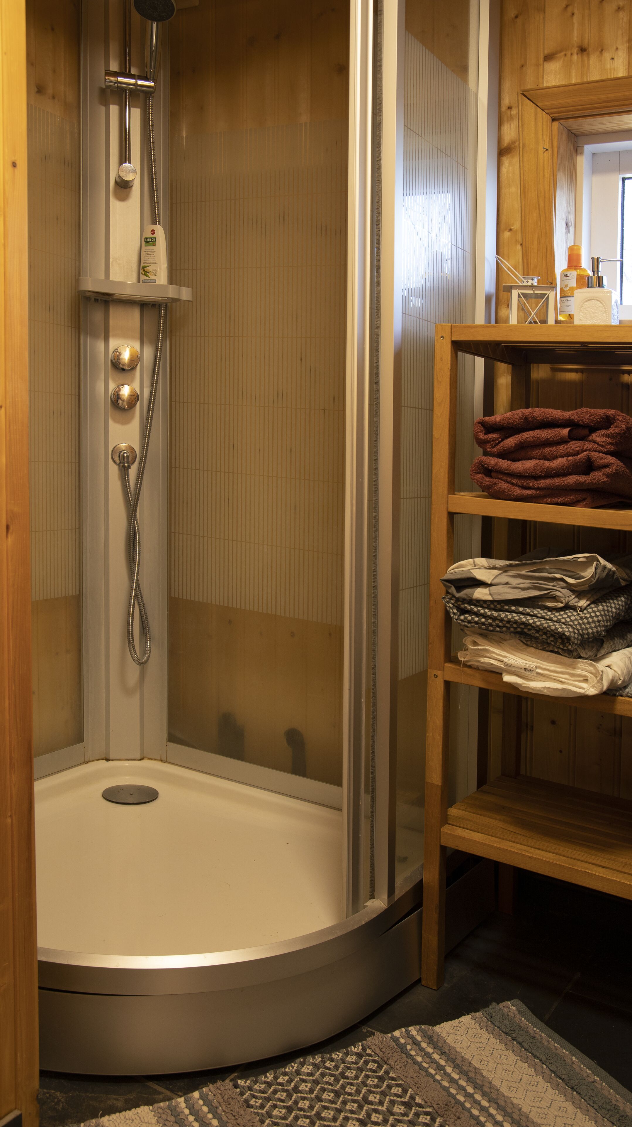 Shower, hair dryer, slippers, towels