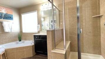 Bathtub, hair dryer, towels, soap