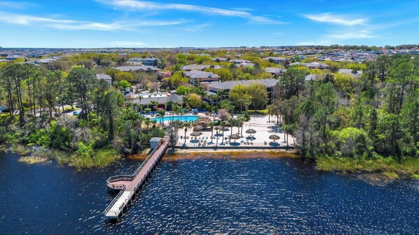 A residential area with houses, a dock, and a swimming pool.