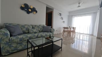 Comfort Apartment | Living area | 50-inch Smart TV with digital channels, TV, first-run films