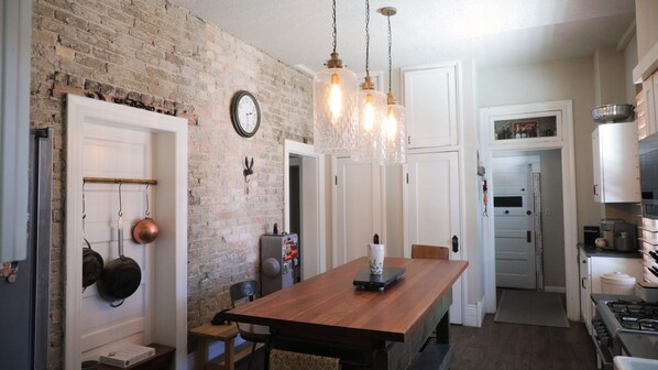 Enjoy cooking in this well-equipped kitchen with a refrigerator, stove, and ample counter space.