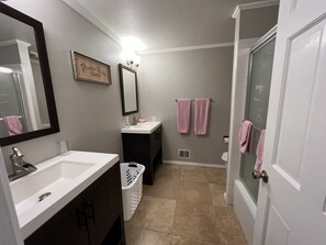 Shower, hair dryer, towels, soap