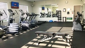 A gym with treadmills, elliptical machines, and a stationary bike. - Feet in the Sand Home- 13 Val (Laguna Vista)