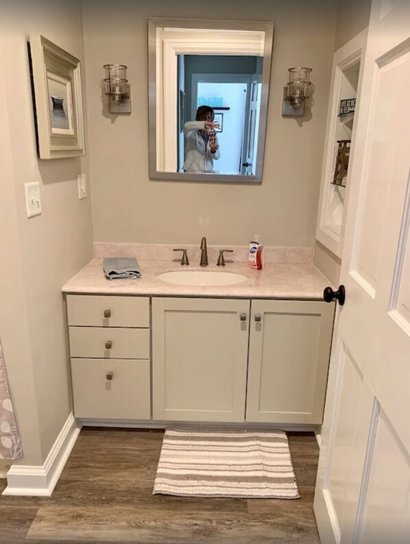 Bathtub, hair dryer, towels, soap