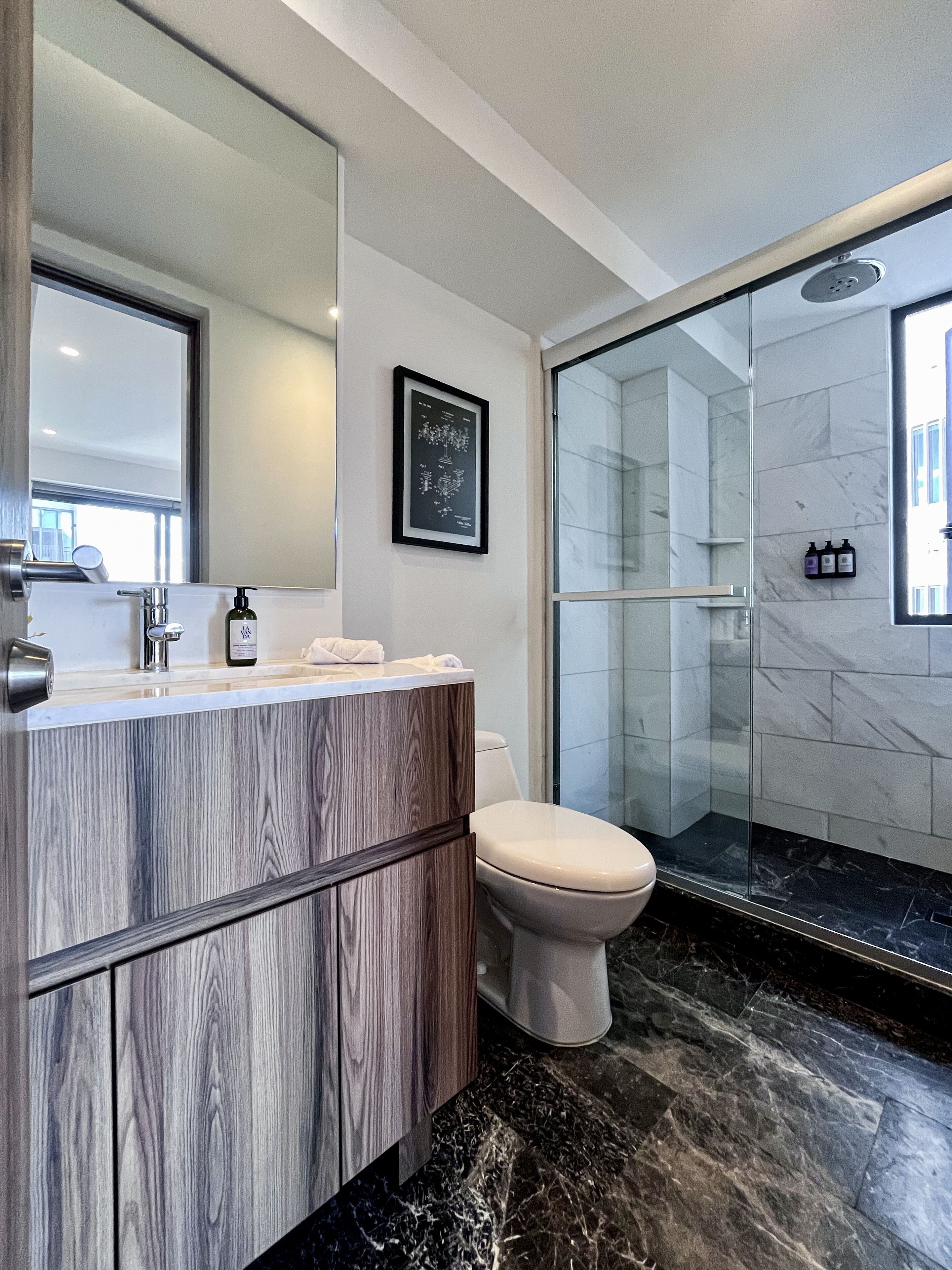 Signature Apartment | Bathroom | Shower, rainfall showerhead, hair dryer, towels