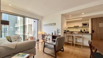 Signature Apartment | Living area | 55-inch Smart TV with digital channels, TV, Netflix