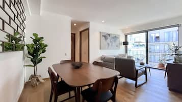 Signature Apartment | Living area | 55-inch Smart TV with digital channels, TV, Netflix