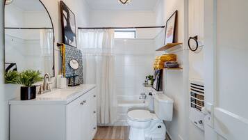 Combined shower/bathtub, hair dryer, towels, soap