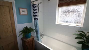 Combined shower/tub, hair dryer, towels, soap