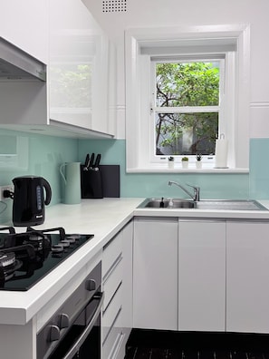 Kitchen with gas cooktop and oven