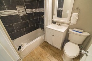 Bathtub, free toiletries, hair dryer, towels