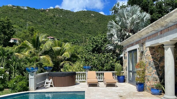 A swimming pool with a hot tub, lounge chairs, and potted plants. - Welcome to your island home, Mystical Mermaid! (Cruz Bay)