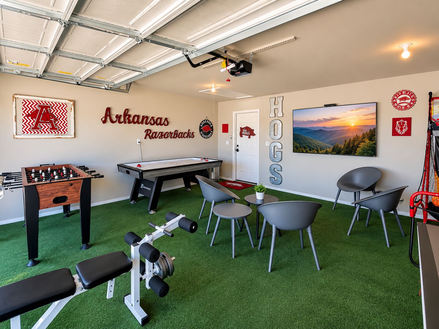 A recreational room with a foosball table, pool table, and exercise equipment.