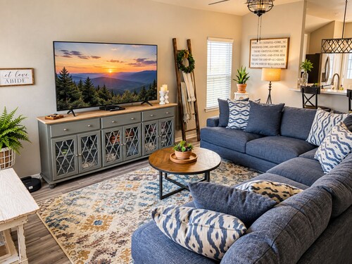 Charming Southern-style home with a signature red door and a Razorback game room—perfect for unwinding after a day in Fayetteville.