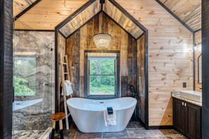 Bathtub, hair dryer, towels, soap