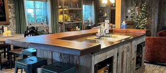 Cozy up in this rustic Stone Lodge and relax by the fireplace