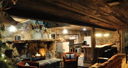 Cozy up in this rustic Stone Lodge and relax by the fireplace