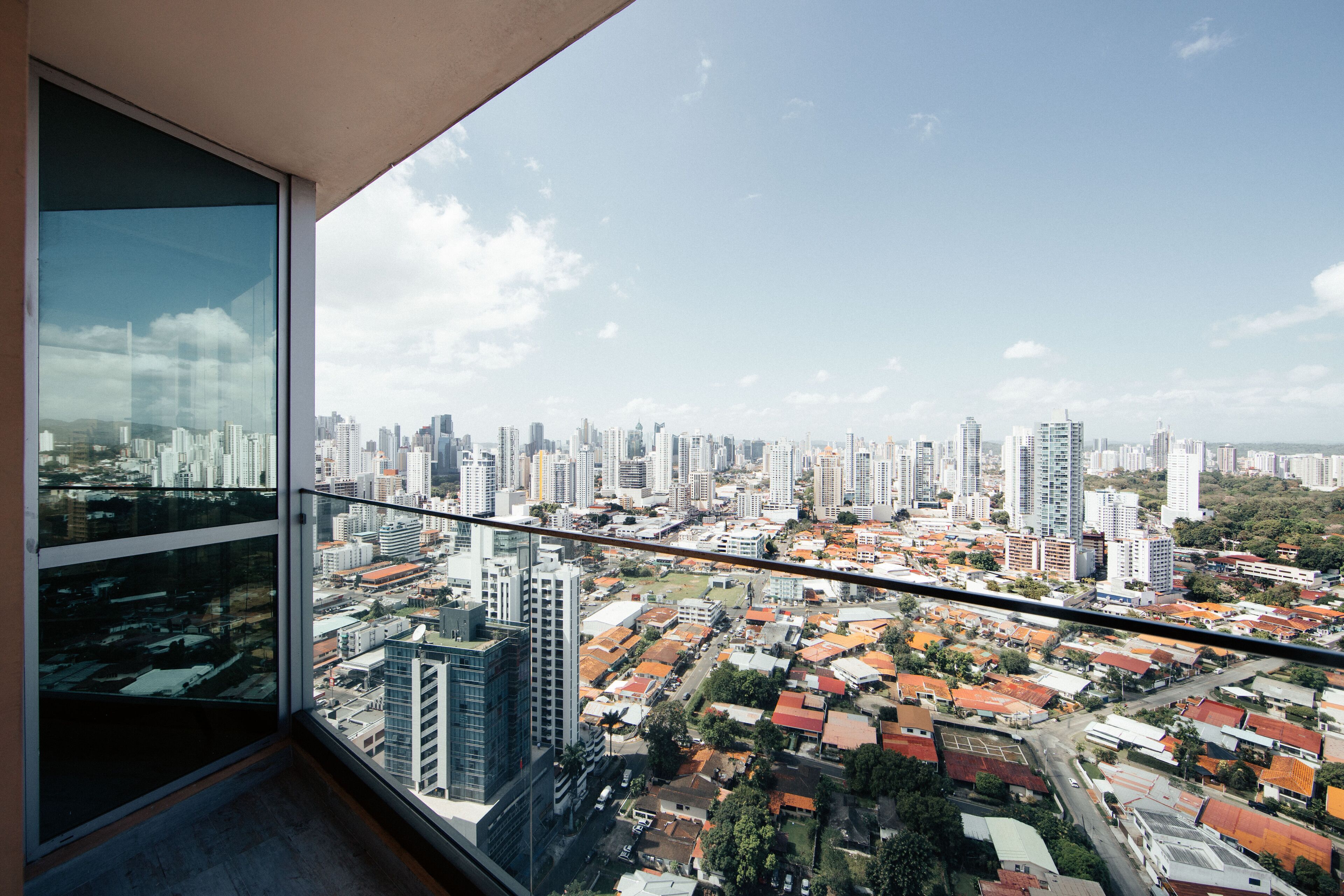 A high-rise building with a panoramic view of a cityscape.