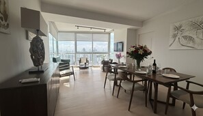 Family Apartment, 3 Bedrooms | Living area | 32-inch Smart TV with digital channels, TV, Netflix