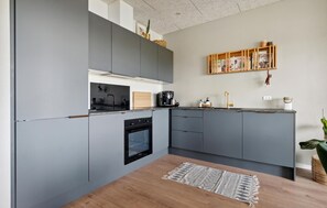 Fridge, dishwasher, coffee/tea maker, cookware/dishes/utensils