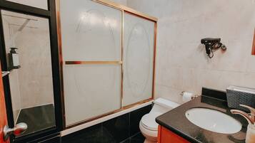 Combined shower/tub, hair dryer, towels, soap