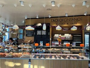 Indulge in the sweet treats on display at Paolo Fontanat, where freshly baked goods and warm ambiance await.