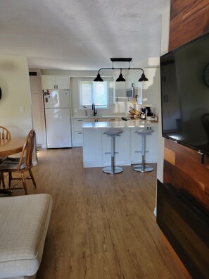 Enjoy cooking and dining in this well-equipped kitchen with a central island and dining area.