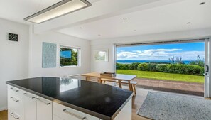 Panoramic House | Private kitchen | Full-size fridge, microwave, oven, stovetop - Palm Ridge - near Onetangi & Palm Beach (Waiheke Island)