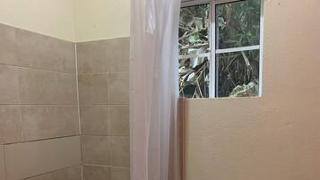 Shower, towels, soap, toilet paper