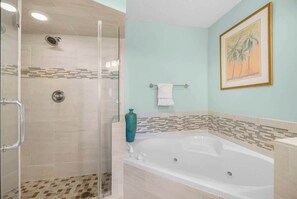 Shower, hair dryer, towels, shampoo
