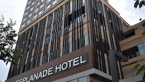 A tall hotel building with a modern design, featuring a prominent sign for 'ESPLANADE HOTEL'. - KSL Esplanade Hotel (Teluk Panglima Garang)