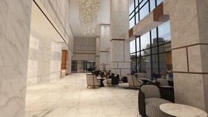 A spacious lobby with marble flooring, modern furniture, and large windows offering views of the outdoors. - KSL Esplanade Hotel (Teluk Panglima Garang)