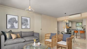 Appartement Exclusif | Coin séjour | Télévision à écran plat de 40 pouces avec chaînes par câble, télévision