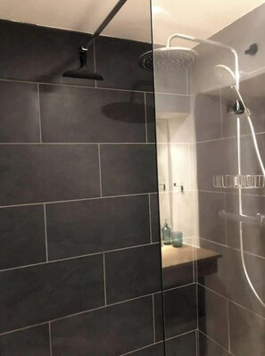 Shower, hair dryer, towels, toilet paper