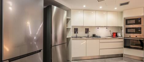 Microwave, oven, cookware/dishes/utensils, dining tables