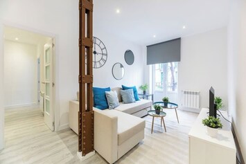 General view of the living room with access to one of the balconies