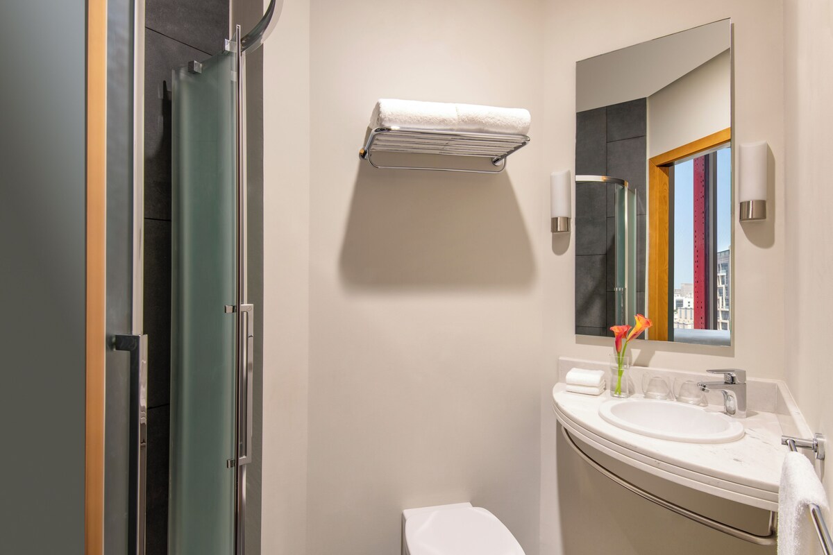 Shower, eco-friendly toiletries, hair dryer, towels