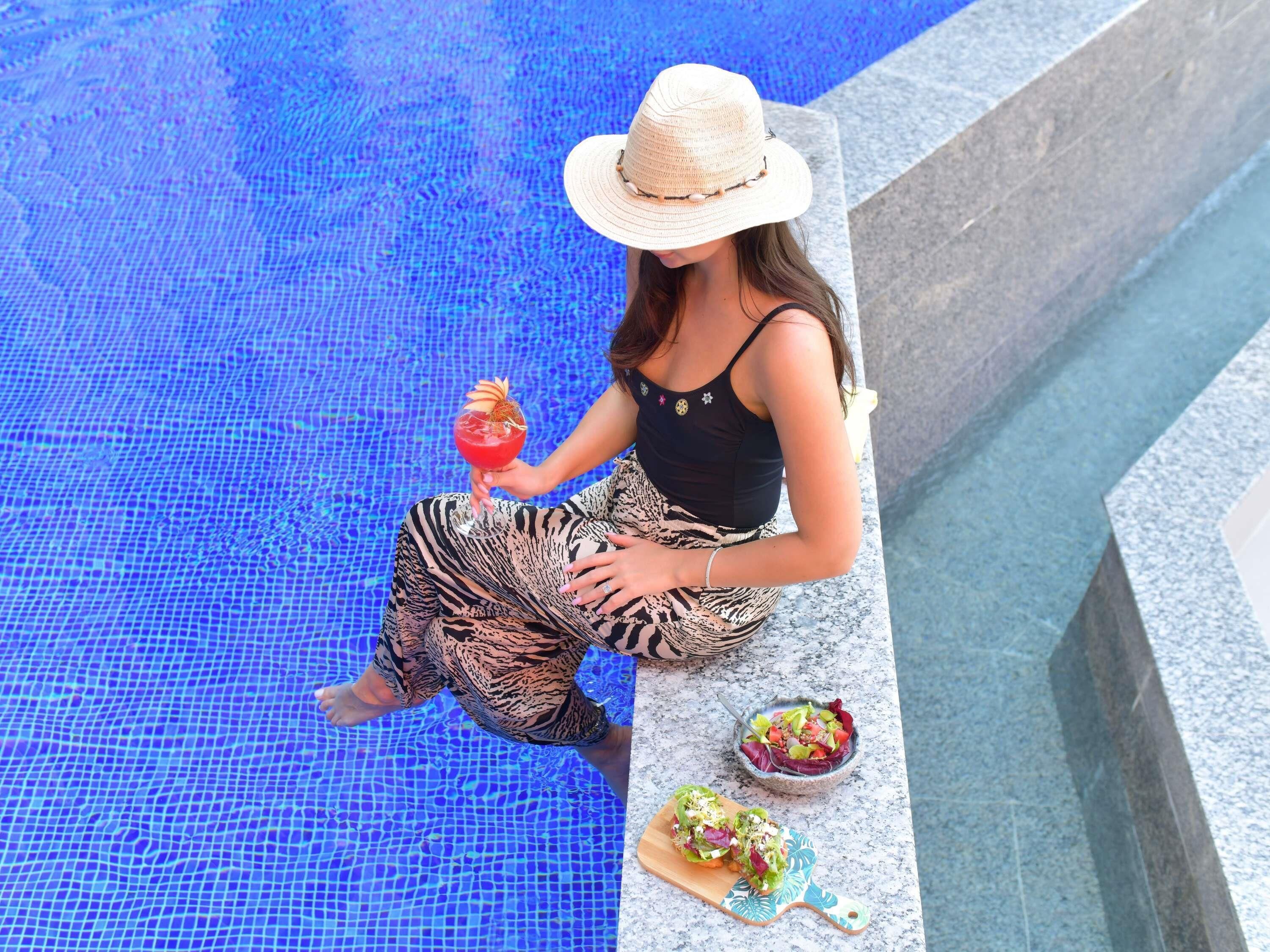 Outdoor pool, open 8:00 AM to 10:00 PM, pool umbrellas, pool loungers