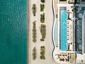 2 outdoor pools, open 8:00 AM to 8:00 PM, pool umbrellas, pool loungers