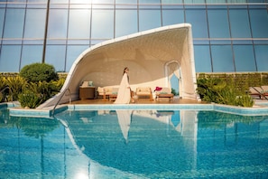 2 outdoor pools, open 8:00 AM to 8:00 PM, pool umbrellas, pool loungers