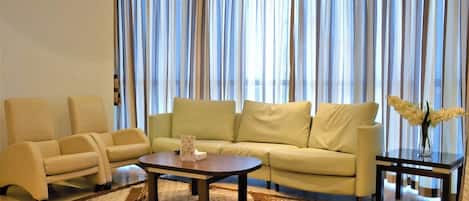 Apartment, 1 Bedroom, Non Smoking, City View | Living area | 50-inch flat-screen TV with satellite channels, TV