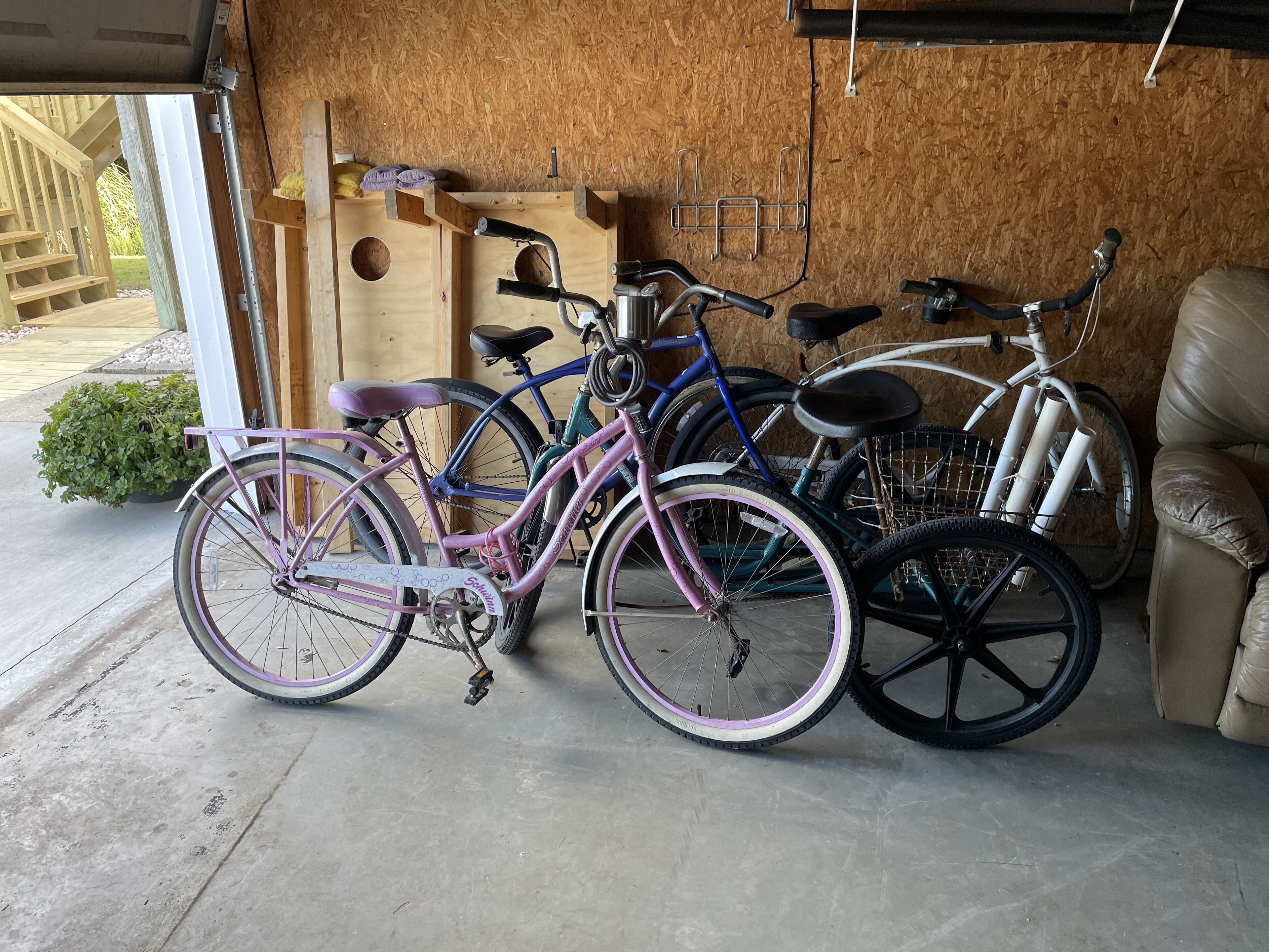 A garage with bicycles parked inside.