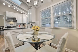 Enjoy cooking in this well-equipped kitchen with a central island, gas stove, and stainless steel appliances.