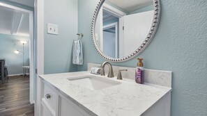 Combined shower/bathtub, hair dryer, towels, soap