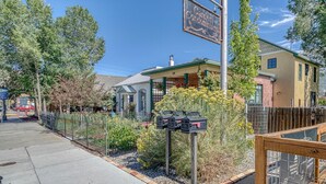 A residential building with a sign reading "Garden Condominiums." - The Brick Unit B on F st Downtown Salida! (Salida)