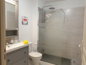 Shower, hair dryer, towels, toilet paper